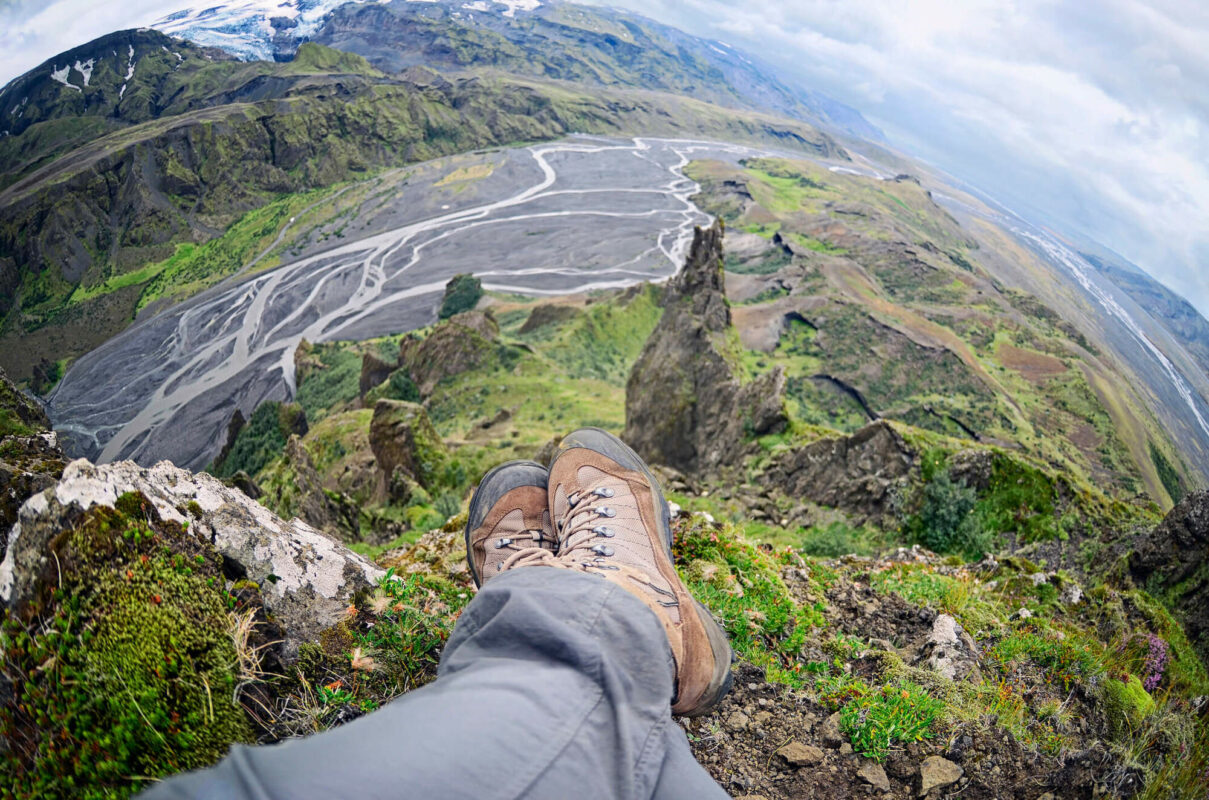 Hiker relaxing on a cliff in Thorsmörk