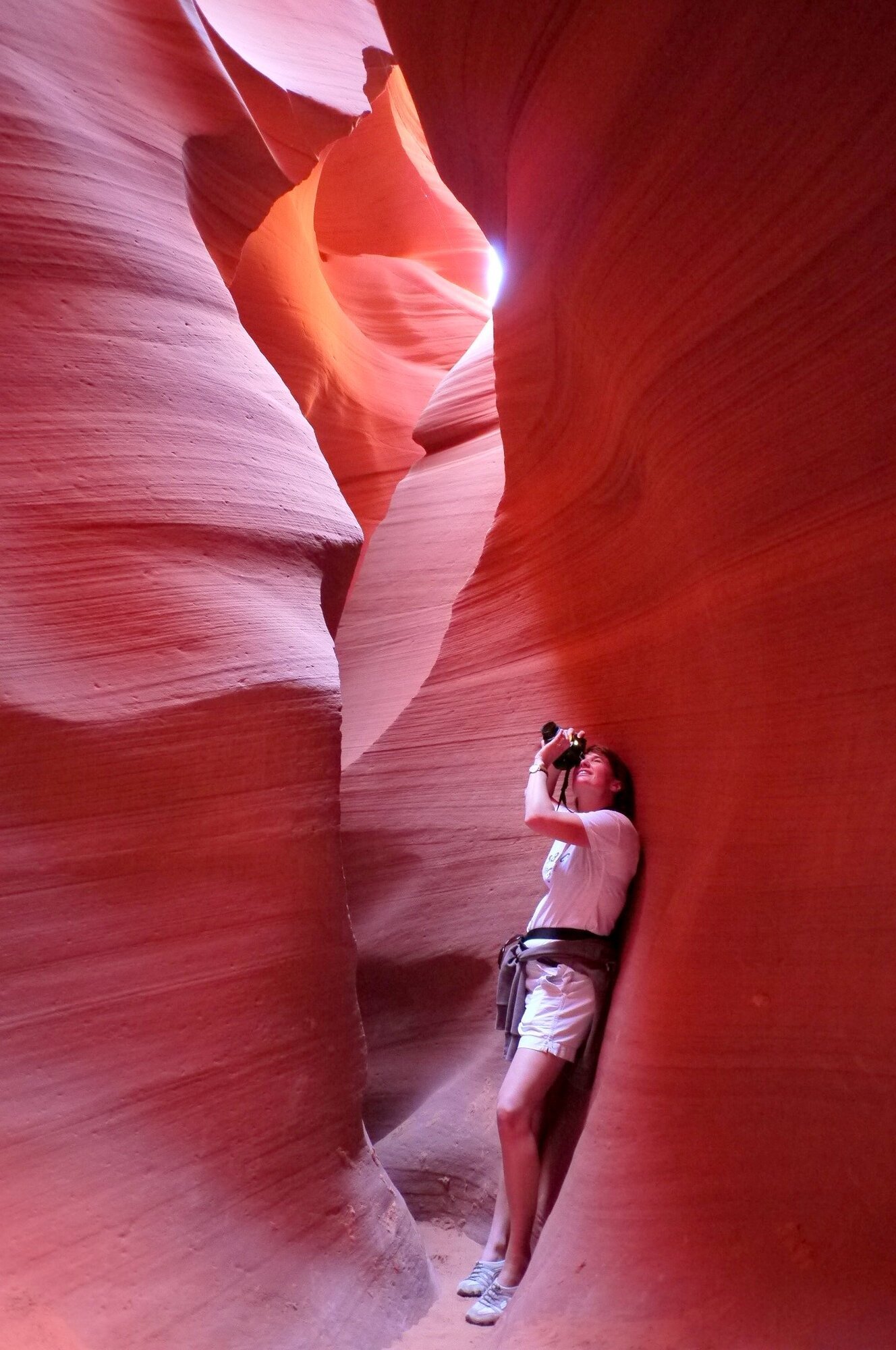 A woman taking a photo in Antelope Canyon