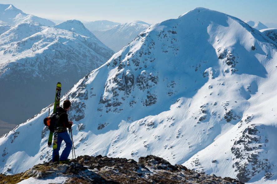 Joe Taylor on top of Buachaille Etive Mòr in the Scottish Highlands, scouting our line to ski down the east face of Stob Na Doire 