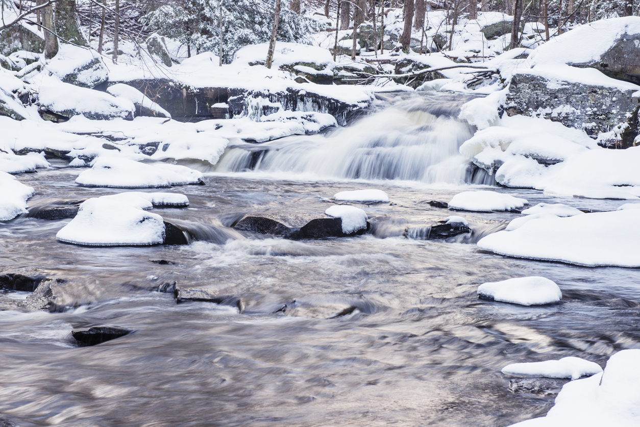 This is a monochromatic photograph of a winter waterfall in the New York Catskill Mountains.