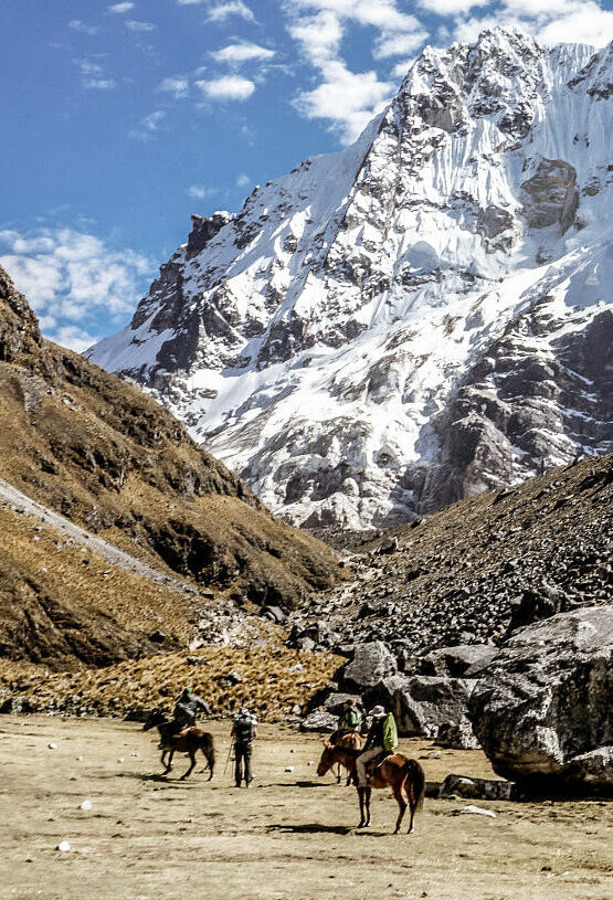 People trekking through Peruvian mountains on their way to Machu Picchu