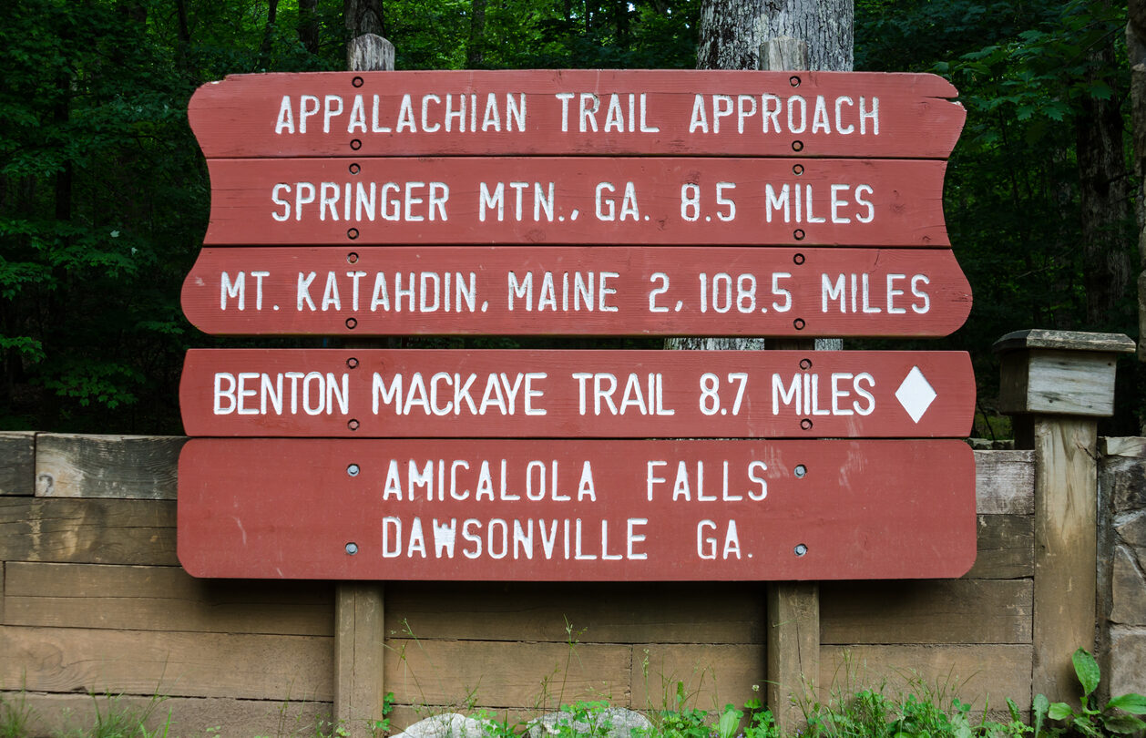 A painted sign gives the distance to Maine from Georgia on the Appalachian Trail
