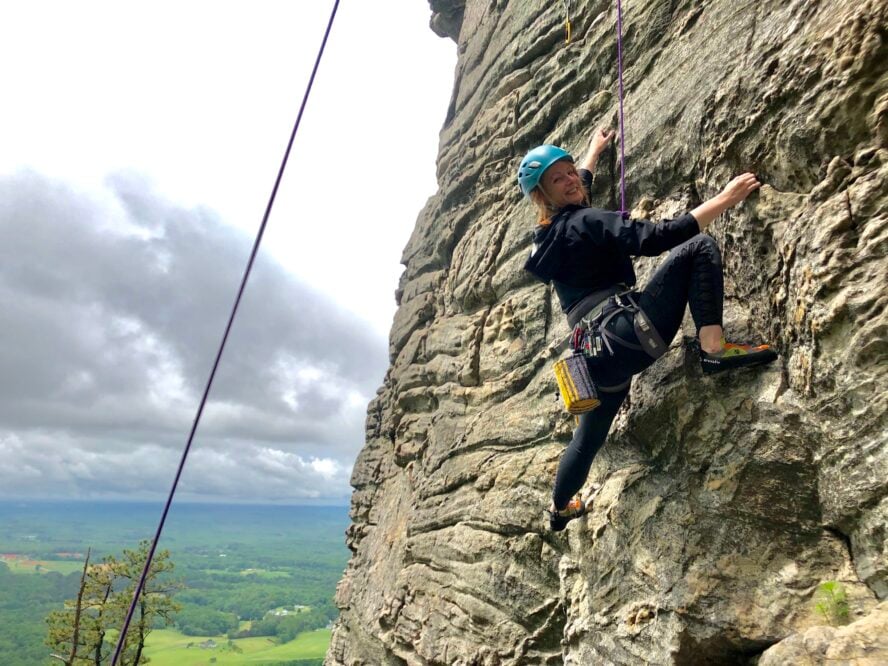 Top roping the south facing quartzite cliffs that define the Pilot Mountain climbing area in the Piedmont region of North Carolina