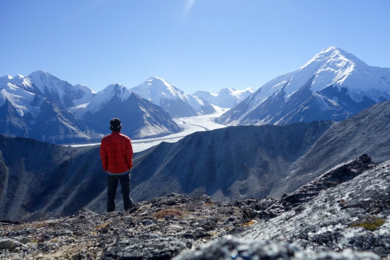 A hiker enjoying the view of Denali