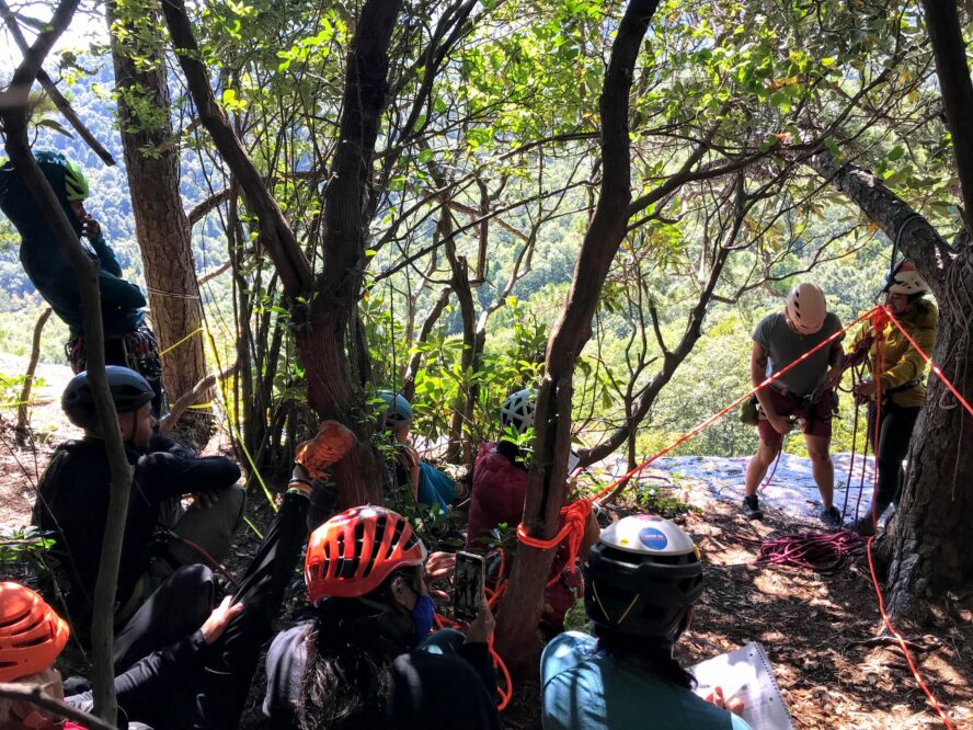 Instructors demonstrate top-managed site and belayed rappel fundamentals at Cedar Rock, NC.