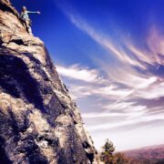 Rock climbing the 3-pitch route Jim Dandy at Table Rock in Linville Gorge.