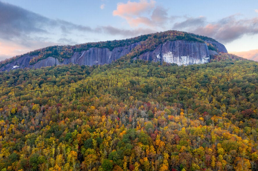 Looking Glass Rock looms over the colorful autumn foliage in the distance.