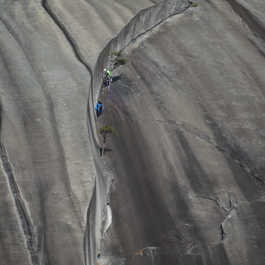 Climbers on the classic route The Great Arch located at Stone Mountain in North Carolina