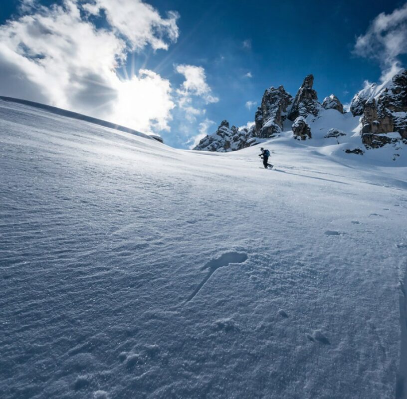 A backcountry skier in fresh powder