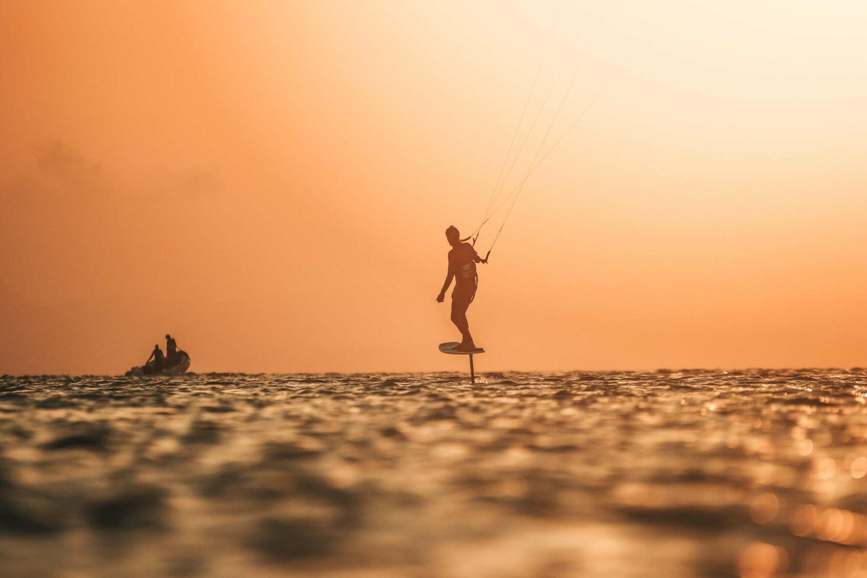 A kitesurfer and a beautiful orange sky in the Red Sea in Egypt