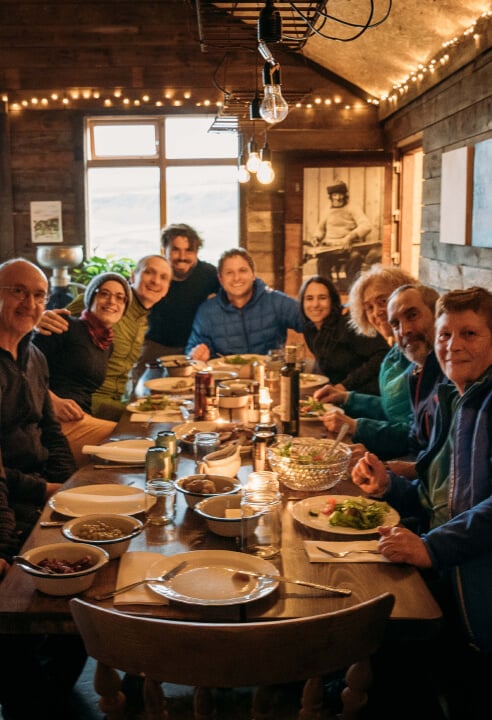 A hiking group having a hearty dinner in a lovely restaurant in Iceland.