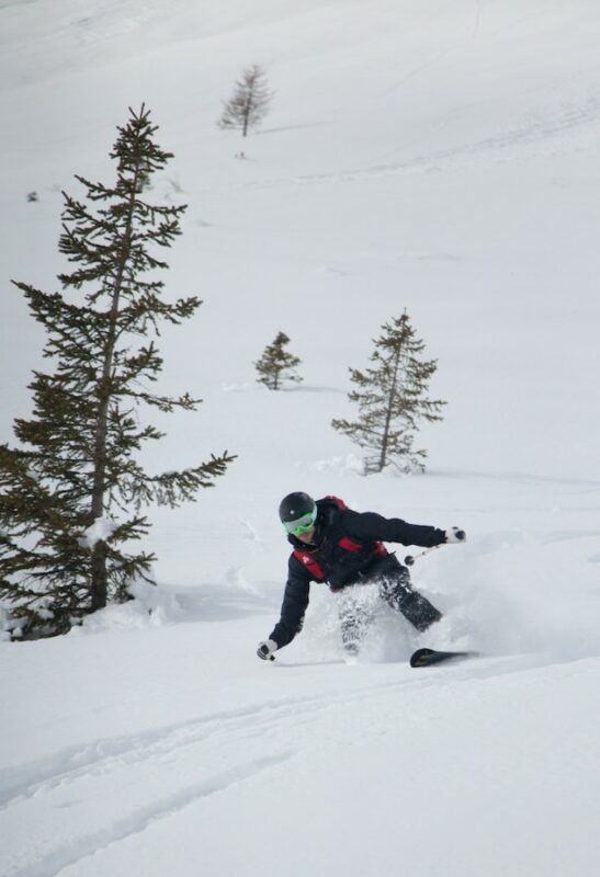 A skier ripping up slopes with his skills