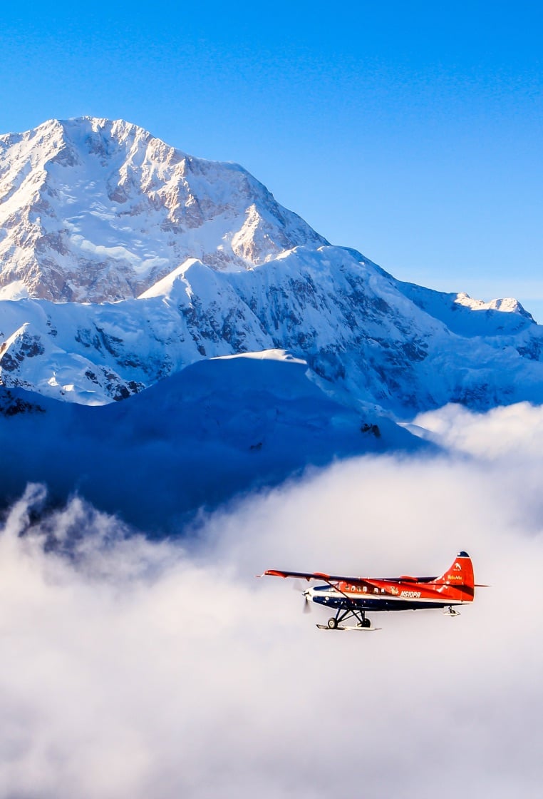 A plane flying over the Ruth glacier and Denali's valleys.