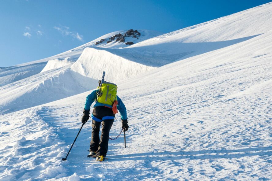 Physical exertion is a good way to warm up the body while you’re winter hiking.