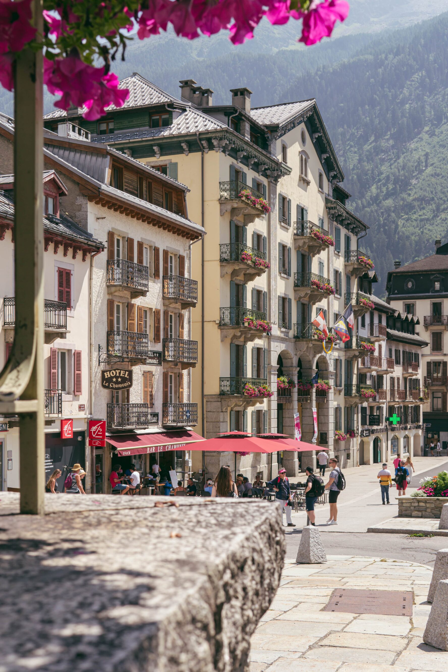 A Chamonix square full of people at noon