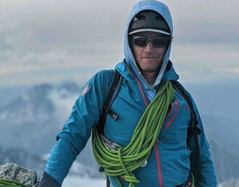 Jeff Bullock in full gear on top of a mountain