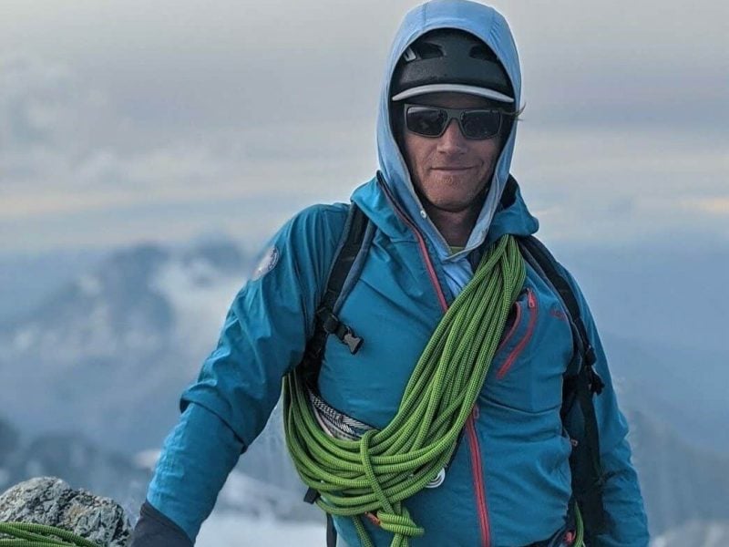 Jeff Bullock in full gear on top of a mountain