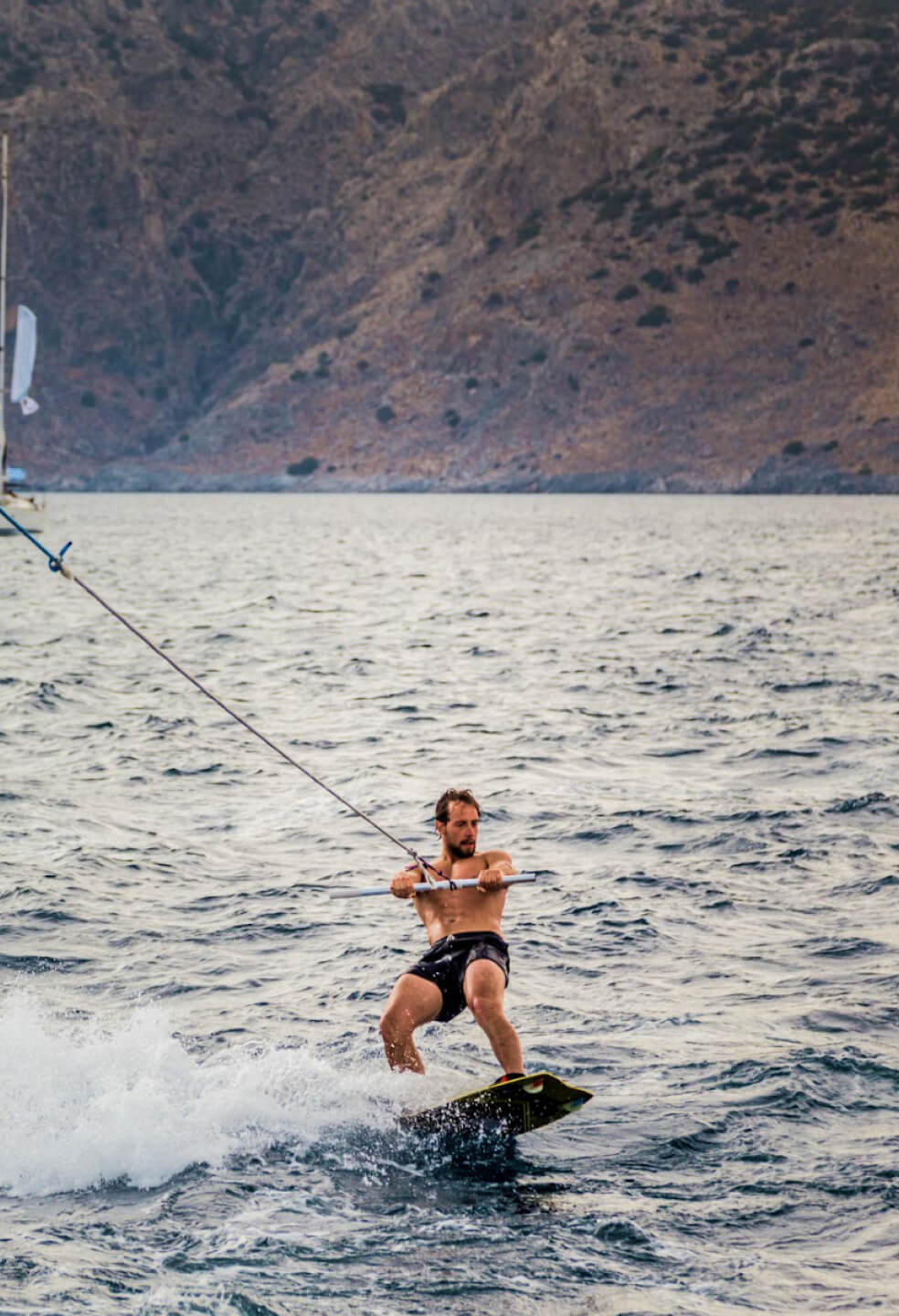 Don’t miss boat surfing when sailing around Sardinia!