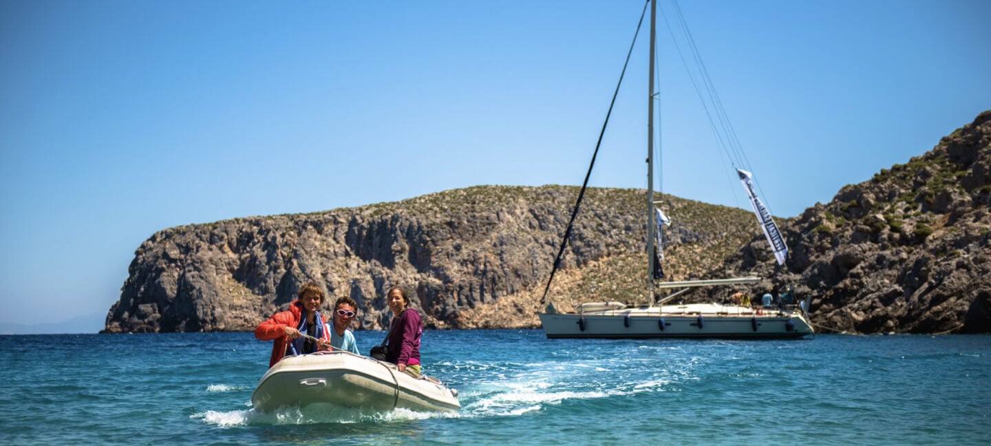 Experience the crystal clear sea of Sardinia on a boat.