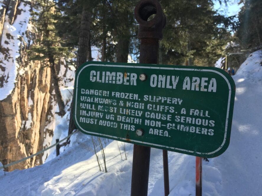 A warning sign about the dangers of ice climbing near the entrance to the Ouray Ice Park