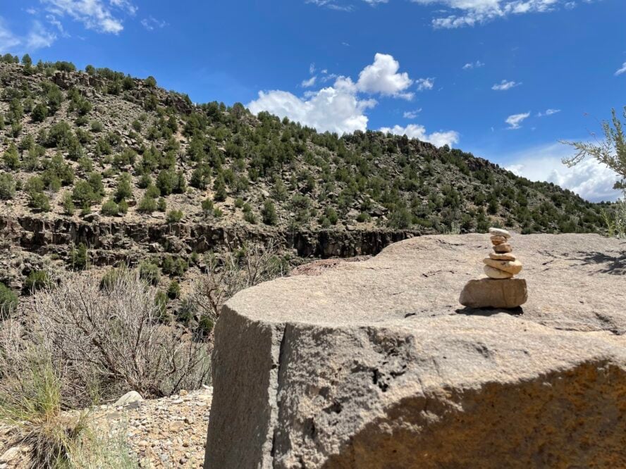 Hiking cairns are small piles of stones stacked together used to show hikers the right direction to go when a trail is unclear.