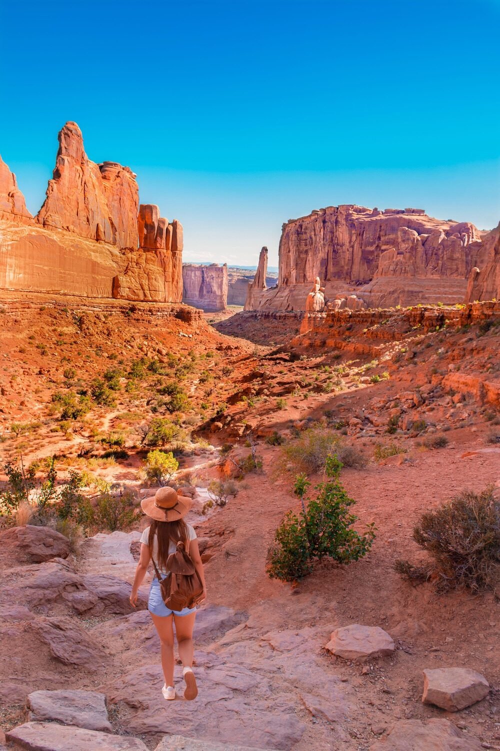 Hiker exploring Arches National Park in Utah