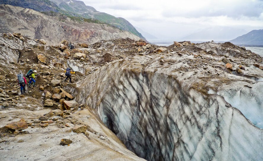 Backpackers hiking on a glacial moraine in Denali National Park