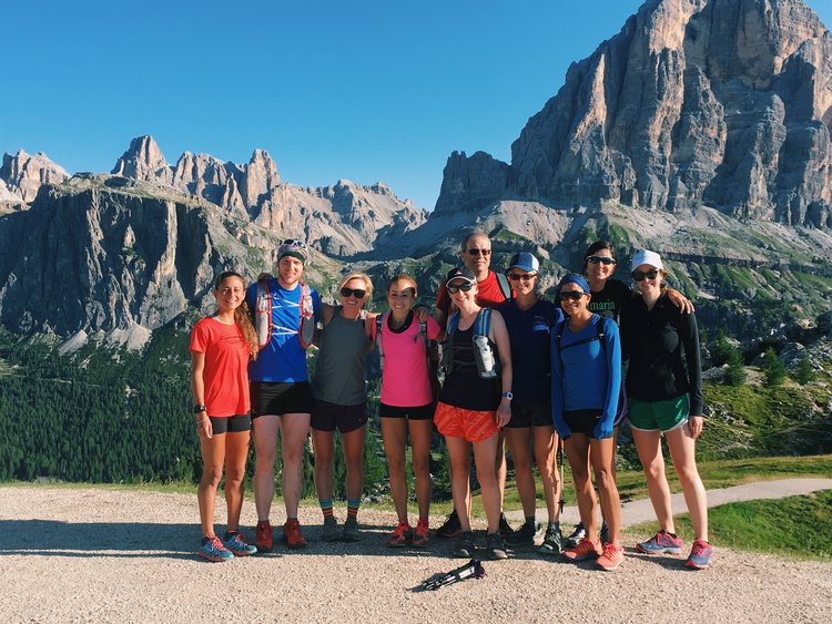 A group photo of trail runners in the Dolomites