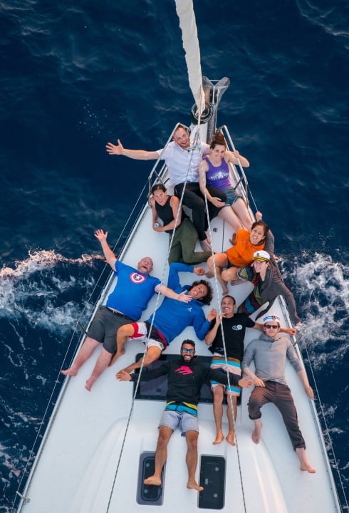 A group of climbers and sailors posing on the ship