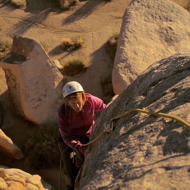 A woman climbing in Joshua Tree National Park