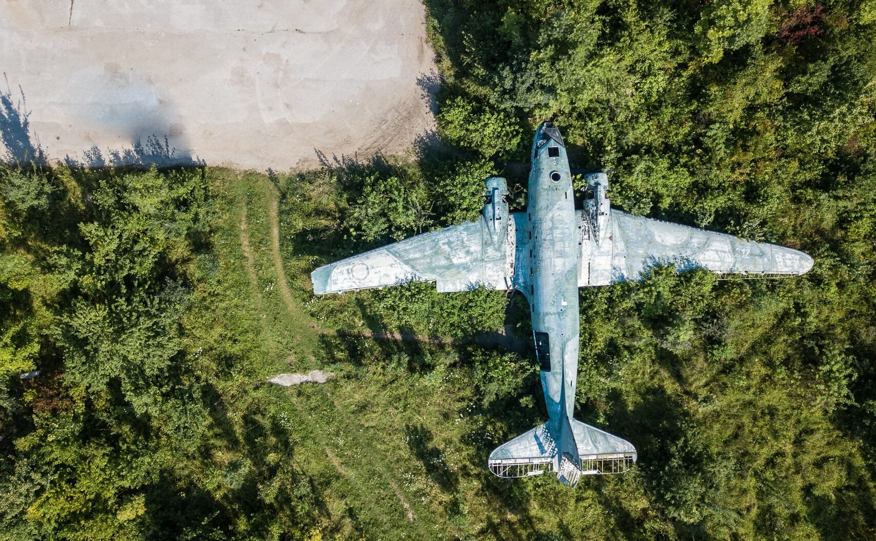 An areal view of Željava airbase with an abandoned plane left from WWII