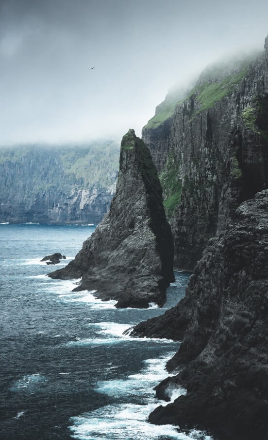 While sailing the Faroe Islands, you will spot many sharp and steep cliffs on its coastline.