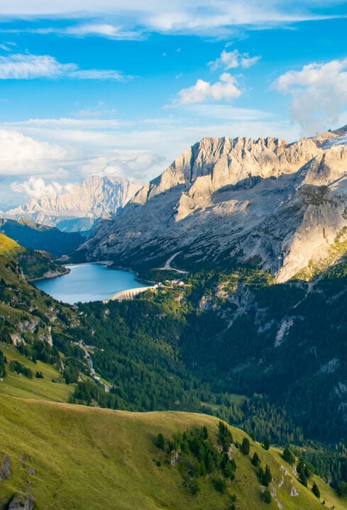 View to Marmolada and Fedaia Lake. Marmolada is the highest mountain of Dolomites, situated in northeast Italy