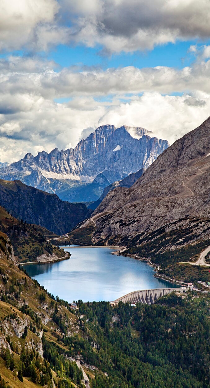 Fedaia lake in Dolomites with view of Marmolada mountain.