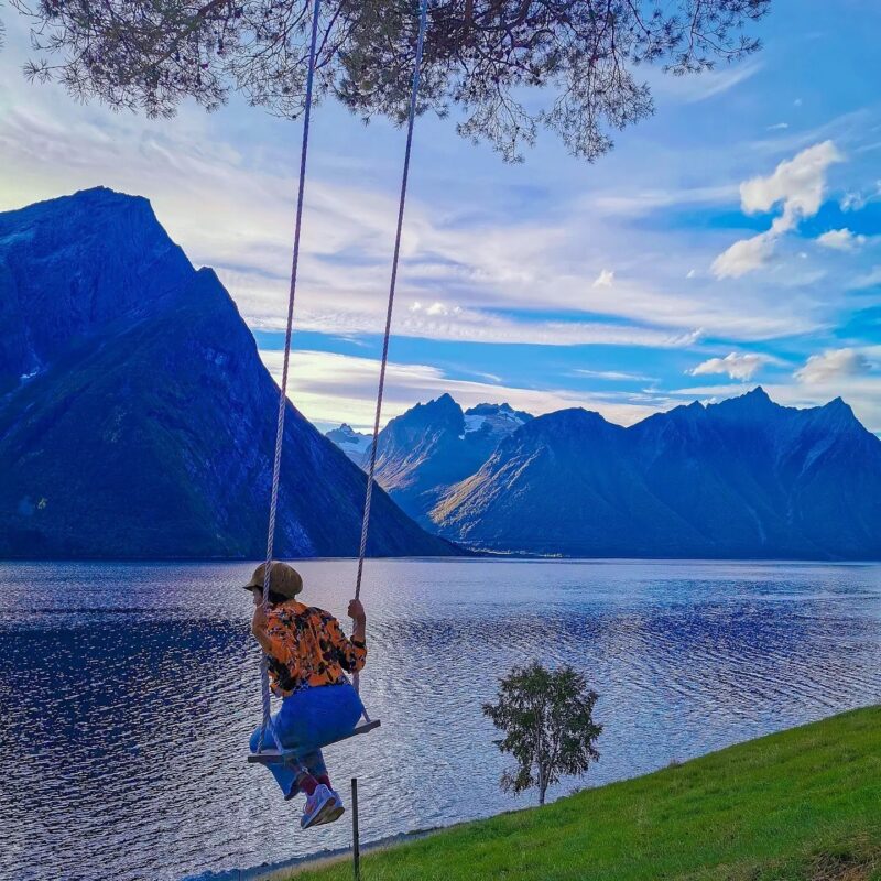 A woman on a swing in Trandal, Norway