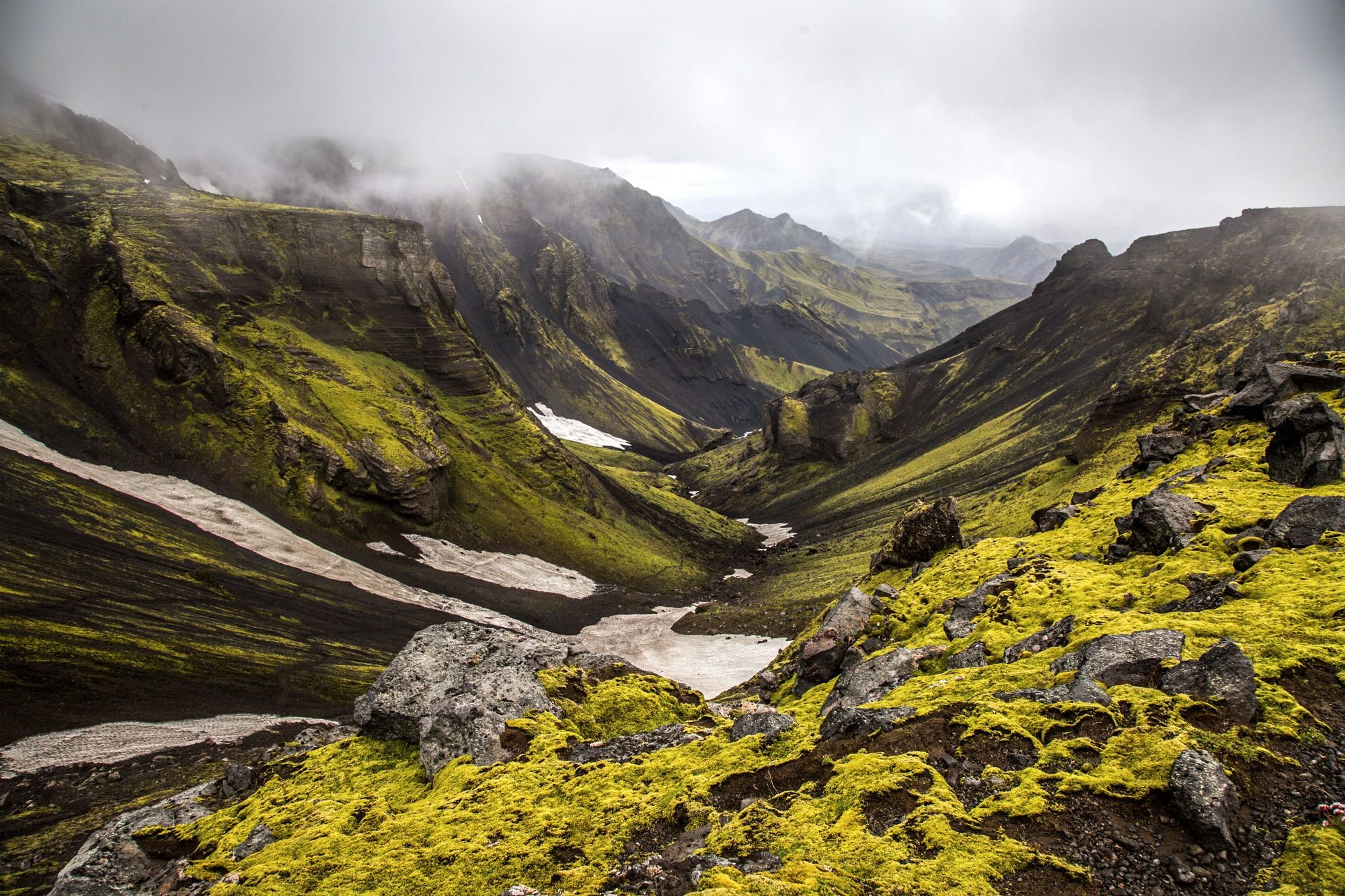 Green valleys dotted with small glacial lakes