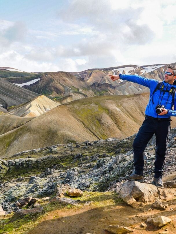 Hikers traversing the river crossing in Iceland.