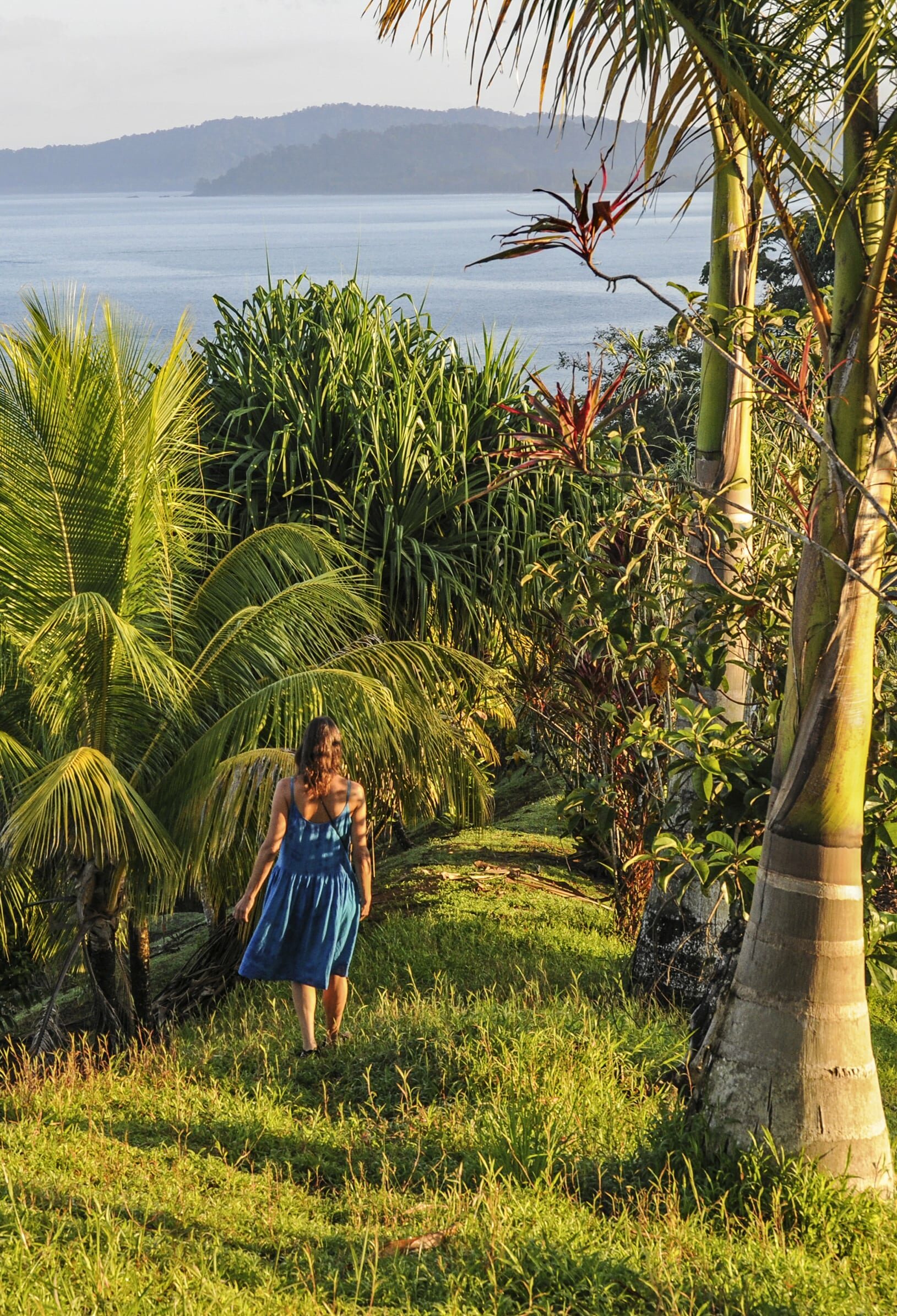 A woman taking a stroll through the hills above Drake Bay, Costa Rica