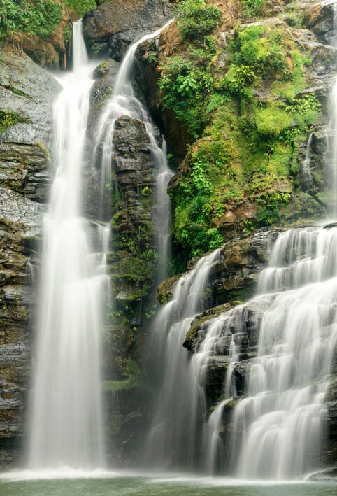 The beautiful Nauyuca Waterfall in the Costa Ballena near Dominical, Costa Rica (sometimes referred to as Santo Cristo Falls).