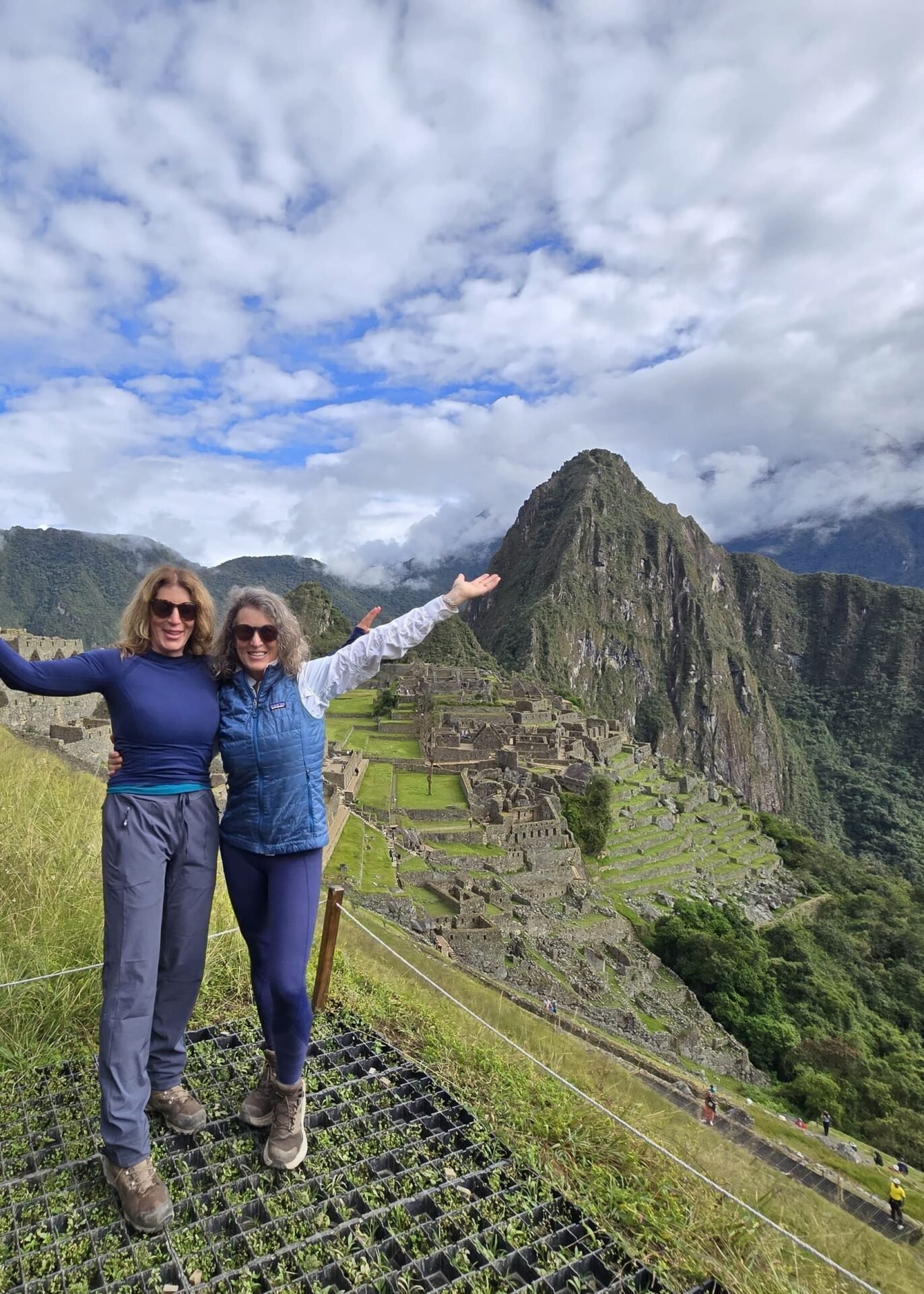 Two hiker summit Machu Picchu