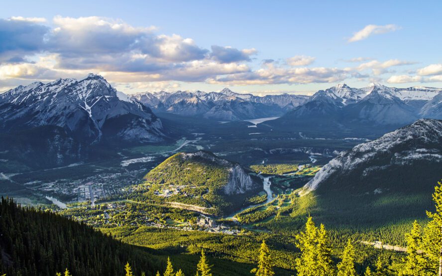 Sulfur Mountain looks over the town of Banff Canada as the sun sets.