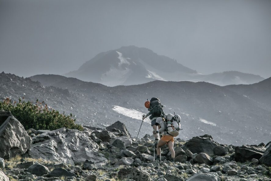 Two female hikers climbing up the Mount Shasta during a glacier training camp