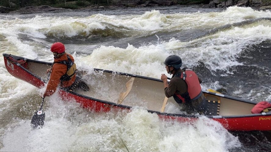 Canoers paddling the Seal River, Canada