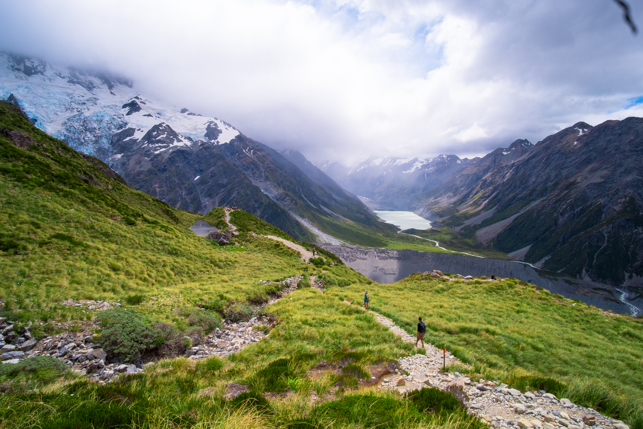 Tourist, backpacker, hiking in hight mountain on Muller hut track in Mt Cook National park