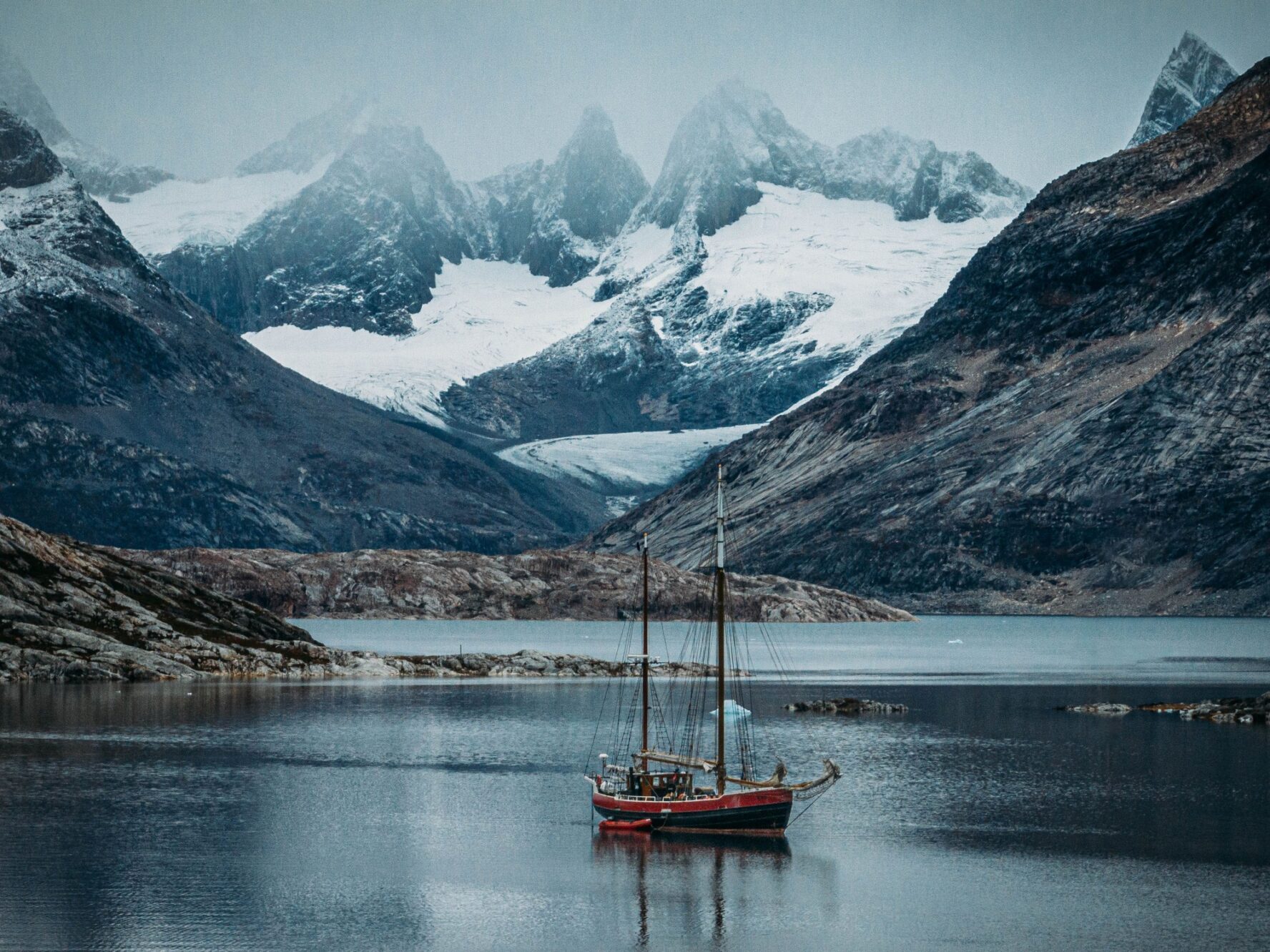 Byr boat and peaks as backdrop