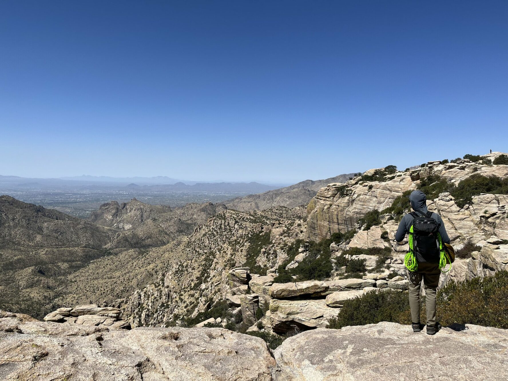 Climber standing and looking at the panorama.