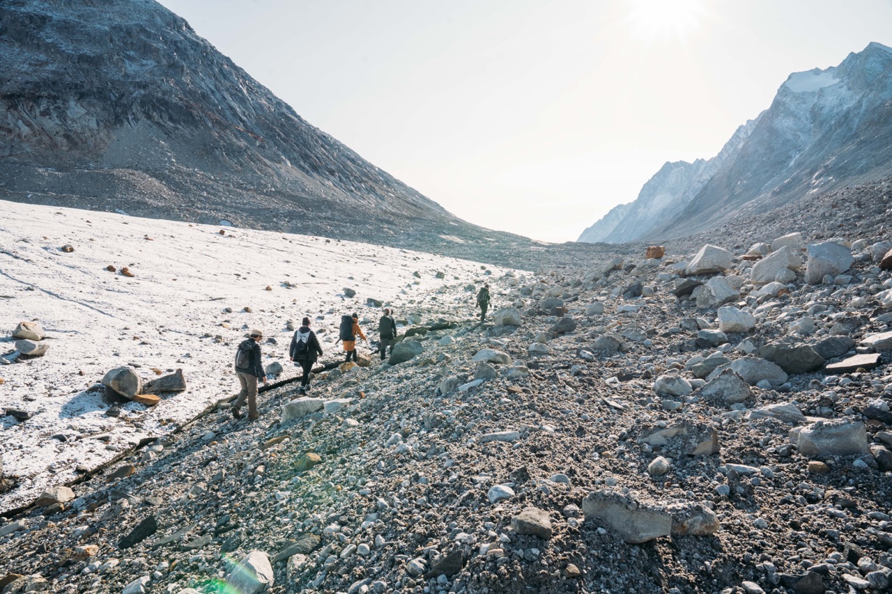 Hikers walking on a glacier