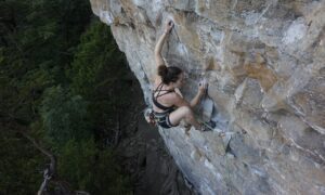 The author climbs Flash Fried (5.12b) at Buffet Wall in Denny Cove.