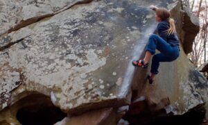 Climber Lisa Rands climbs The Wave (V6) at Stone Fort.