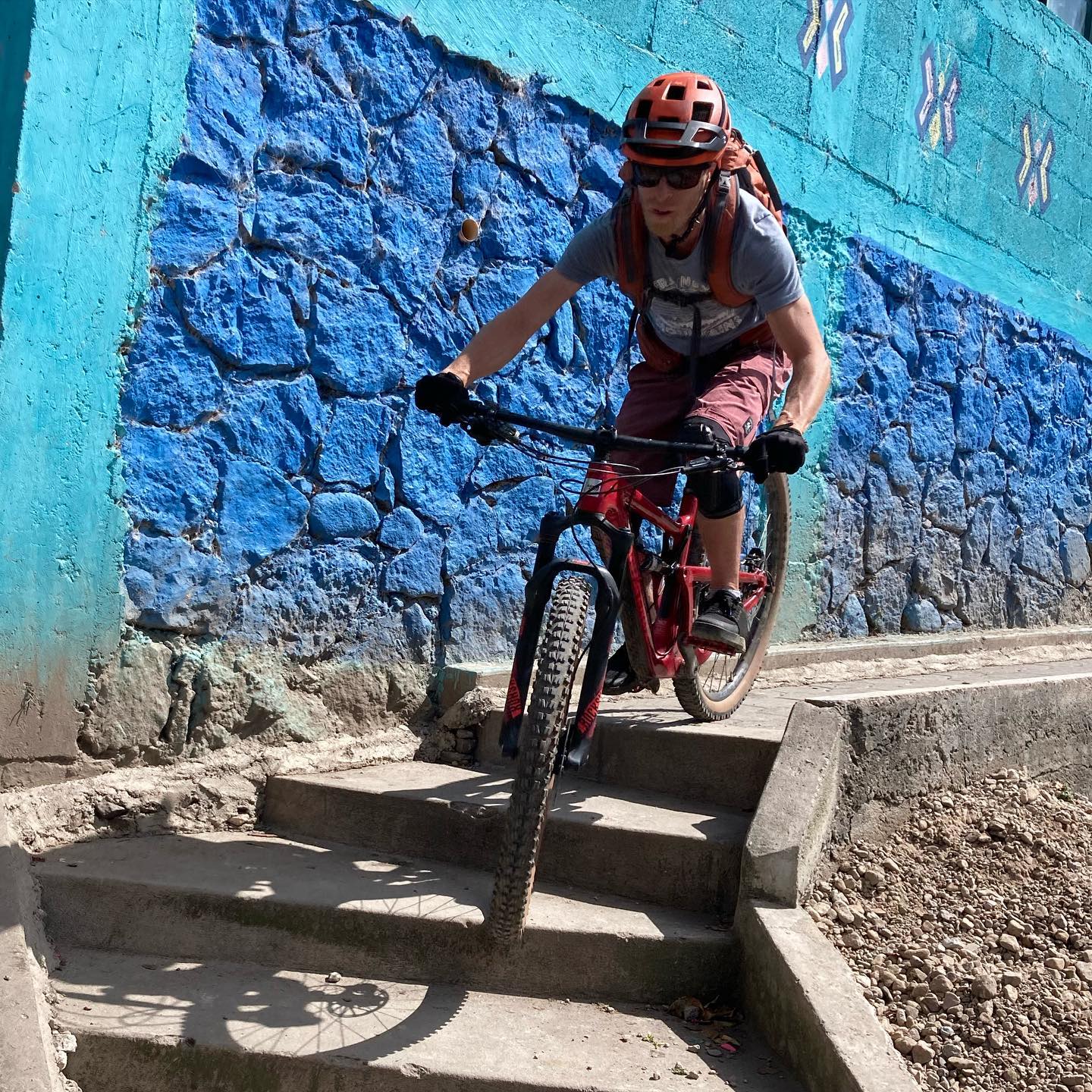 A biker riding on the colorful streets of Antigua, Guatemala.